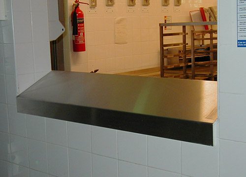 bespoke designed sloping shelf between the bakery and washing areas